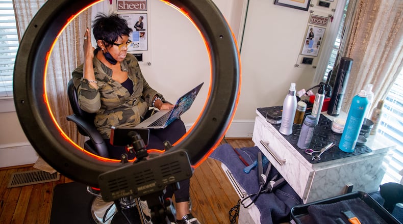 Najah Aziz, reopened her business, Like the River Salon, after Memorial Day and says that she has seen a rebound. “Everybody that came in needed a whole makeover,” she said.  (STEVE SCHAEFER FOR THE ATLANTA JOURNAL-CONSTITUTION)