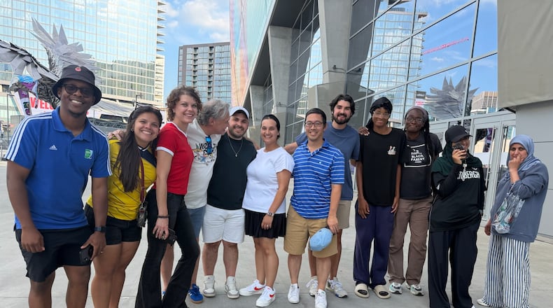 Atlanta sports marketer Vince Thompson (fourth from left) with a group of family, friends, associates, members of the Soccer in the Streets community and an AJC writer pose for a photo outside Mercedes-Benz Stadium at the Haiti-Morocco World Cup game June 24, 2026. (Photo courtesy of Vince Thompson)