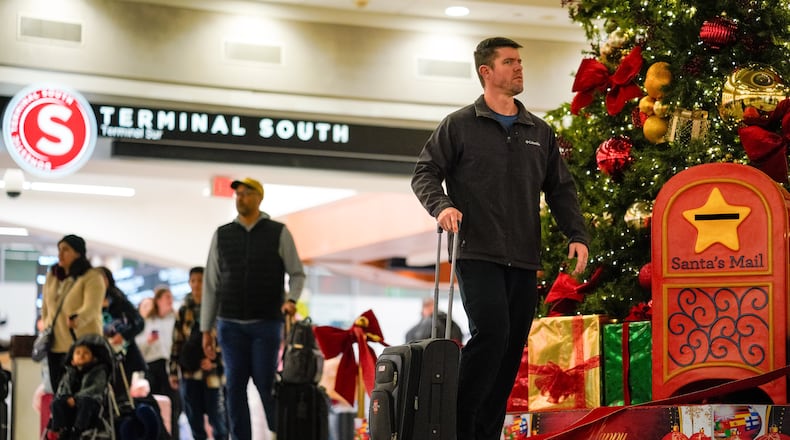 The weekends before and after next week’s Christmas holiday are shaping up to be the busiest at Hartsfield-Jackson Atlanta International Airport. (Ben Hendren for the AJC 2024)