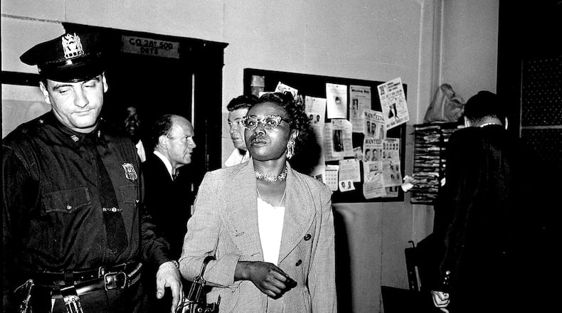 Izola Ware Curry enters a New York City police station, Sept. 20, 1958, where she was questioned in the stabbing of the Rev. Dr. Martin Luther King Jr. in a department store in Harlem during a book signing. Police said the civil rights leader was stabbed by Mrs. Curry, who told them several "rambling" stories and at times was incoherent. (AP Photo/Marty Lederhandler)