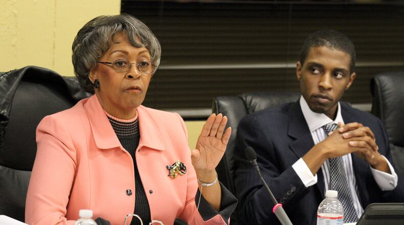 East Point Mayor Earnestine Pittman speaks while councilman Alexander Gothard listens after residents got a chance to express their opinions on the subject of water/sewer rates vs. property tax increase during the city council meeting on Monday Mar. 5, 2012.