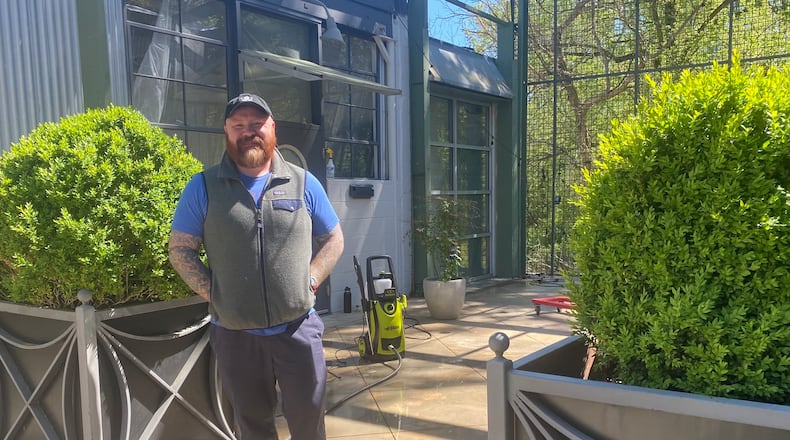 Chef Kevin Gillespie stands at the entrance to his soon-to-open restaurant Nadair. Located at 1123 Zonolite Road in the former Floataway Cafe space, the restaurant will focus on reimagined, elevated Scottish cuisine. May 8 is the target opening date. / Ligaya Figueras/lfigueras@ajc.com