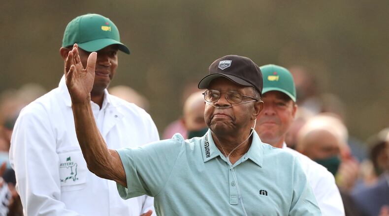 Lee Elder accepts the applause of the patrons during his introduction at the ceremonial tee shot to begin the Masters Thursday at Augusta National Golf Club.