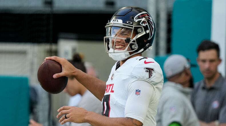 Falcons quarterback Desmond Ridder warms up before a game against the Miami Dolphins, Friday, Aug. 11, 2023, in Miami Gardens, Fla. (AP Photo/Marta Lavandier)