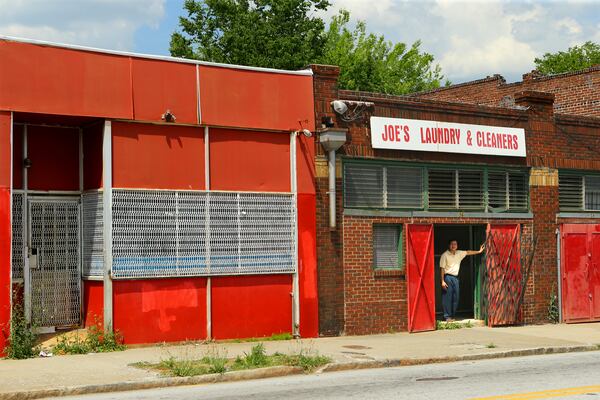 The development partners of Georgia State University said they will turn the boarded up storefronts along Georgia Avenue into a mix of shops, restaurants and a brewery/beer garden. CURTIS COMPTON / CCOMPTON@AJC.COM