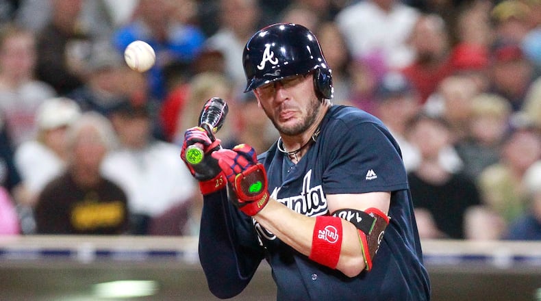 With the bases loaded, the Atlanta Braves' Tyler Flowers is hit by a pitch from the San Diego Padres' Phil Maton during the sixth inning at Petco Park Wednesday, June 28. 2017, in San Diego.