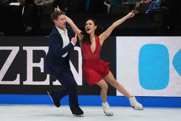 Madison Chock and Evan Bates, of the United States, perform during the ice dance rhythm dance program at the figure skating world championships, Friday, March 28, 2025, in Boston. (AP Photo/Charles Krupa)