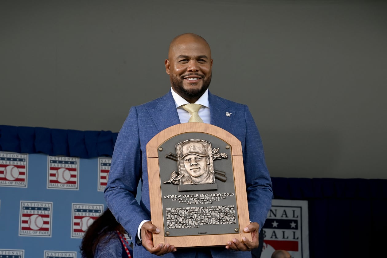Andruw Jones poses with his Hall of Fame plaque during the National Baseball Hall of Fame induction ceremony at the Clark Sports Center on Sunday, July 26, 2026, in Cooperstown, N.Y. The Braves center fielder Andruw Jones was inducted alongside Carlos Beltrán and Jeff Kent. (Hyosub Shin/AJC)