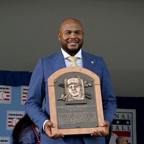 Andruw Jones poses with his Hall of Fame plaque during the National Baseball Hall of Fame induction ceremony at the Clark Sports Center on Sunday, July 26, 2026, in Cooperstown, N.Y. The Braves center fielder Andruw Jones was inducted alongside Carlos Beltrán and Jeff Kent. (Hyosub Shin/AJC)