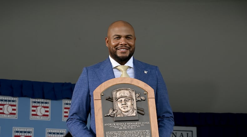 Andruw Jones poses with his Hall of Fame plaque during the National Baseball Hall of Fame induction ceremony at the Clark Sports Center on Sunday, July 26, 2026, in Cooperstown, N.Y. The Braves center fielder Andruw Jones was inducted alongside Carlos Beltrán and Jeff Kent. (Hyosub Shin/AJC)