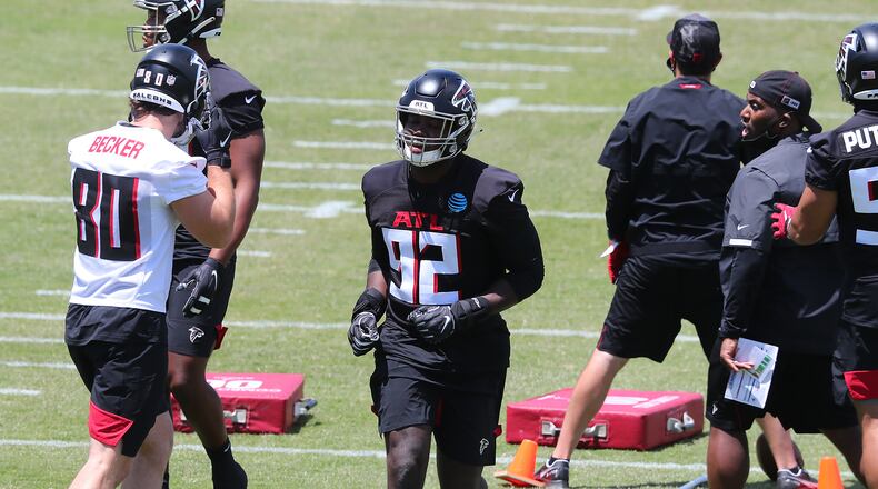 Falcons outside linebacker Ade Ogundeji sprints to the next drill during rookie minicamp in May 2021. (Curtis Compton / Curtis.Compton@ajc.com)