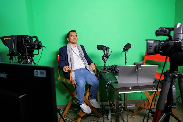 Hour Hum, a Cambodian reporter at Radio Free Asia who spent 7 years in a Thai refugee camp before arriving in the United States, poses for a portrait in the podcast room, Tuesday, April 1, 2025, at the RFA office in Washington. (AP Photo/Rod Lamkey, Jr.)
