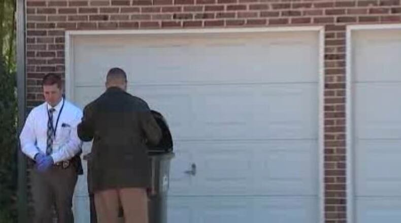 Cobb County police are investigating after a man's body was found on a porch in the Austell area.