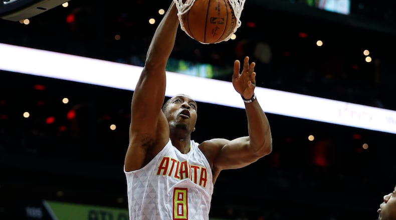 Atlanta Hawks center Dwight Howard (8) scores in the first half of an NBA basketball game against the Miami Heat Wednesday, Dec. 7, 2016, in Atlanta. (AP Photo/John Bazemore)