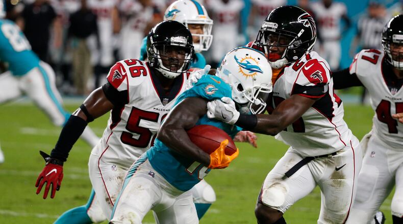 Atlanta Falcons cornerback Damontae Kazee (27) tackles Miami Dolphins wide receiver Jakeem Grant (19), during the first half of an NFL preseason football game, Thursday, Aug. 10, 2017, in Miami Gardens, Fla. (AP Photo/Wilfredo Lee)