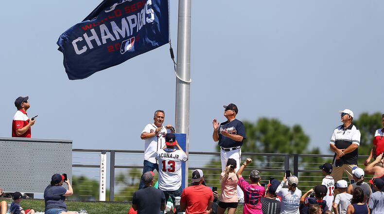 The World Series Champions flag is hoisted in center field at CoolToday Park in North Port, Fla., before the Braves' first exhibition game of the season on March 18. (Curtis Compton / Curtis.Compton@ajc.com)