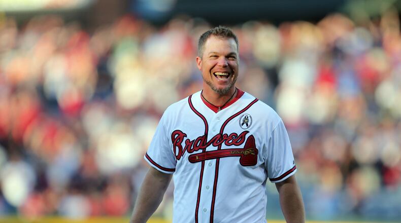 Former Atlanta Braves third baseman Chipper Jones reacts after delivering the ceremonial pitch before the Atlanta Braves season opener.