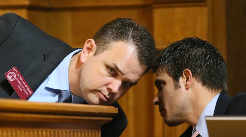 State Rep. Christian Coomer, R-Cartersville, (left) confers with Rep. Dustin Hightower, R – Carrollton. AJC file/Bob Andres,bandres@ajc.com