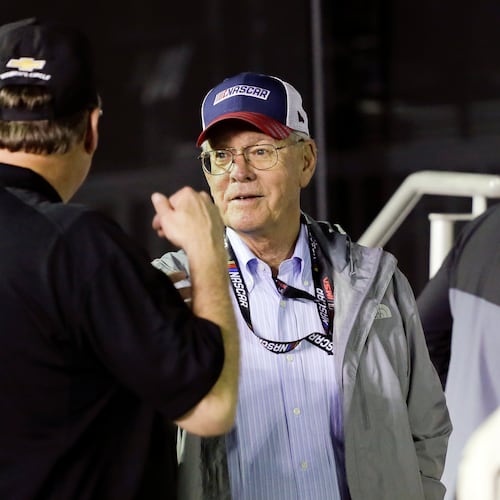 FILE - Jim France, right, chairman and executive vice president of NASCAR, talks with sponsors in Victory Lance after the second of two NASCAR Daytona 500 qualifying auto races at Daytona International Speedway, Thursday, Feb. 13, 2020, in Daytona Beach, Fla. (AP Photo/Terry Renna, File_