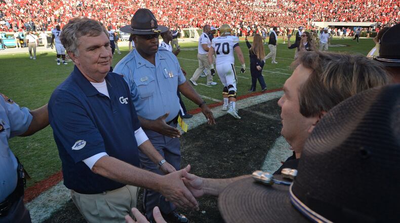 Georgia Tech head coach Paul Johnson and Georgia head coach Kirby Smart shake hands after Georgia Tech won  28-27 over Georgia at Sanford Stadium on Saturday, November 26, 2016. HYOSUB SHIN / HSHIN@AJC.COM