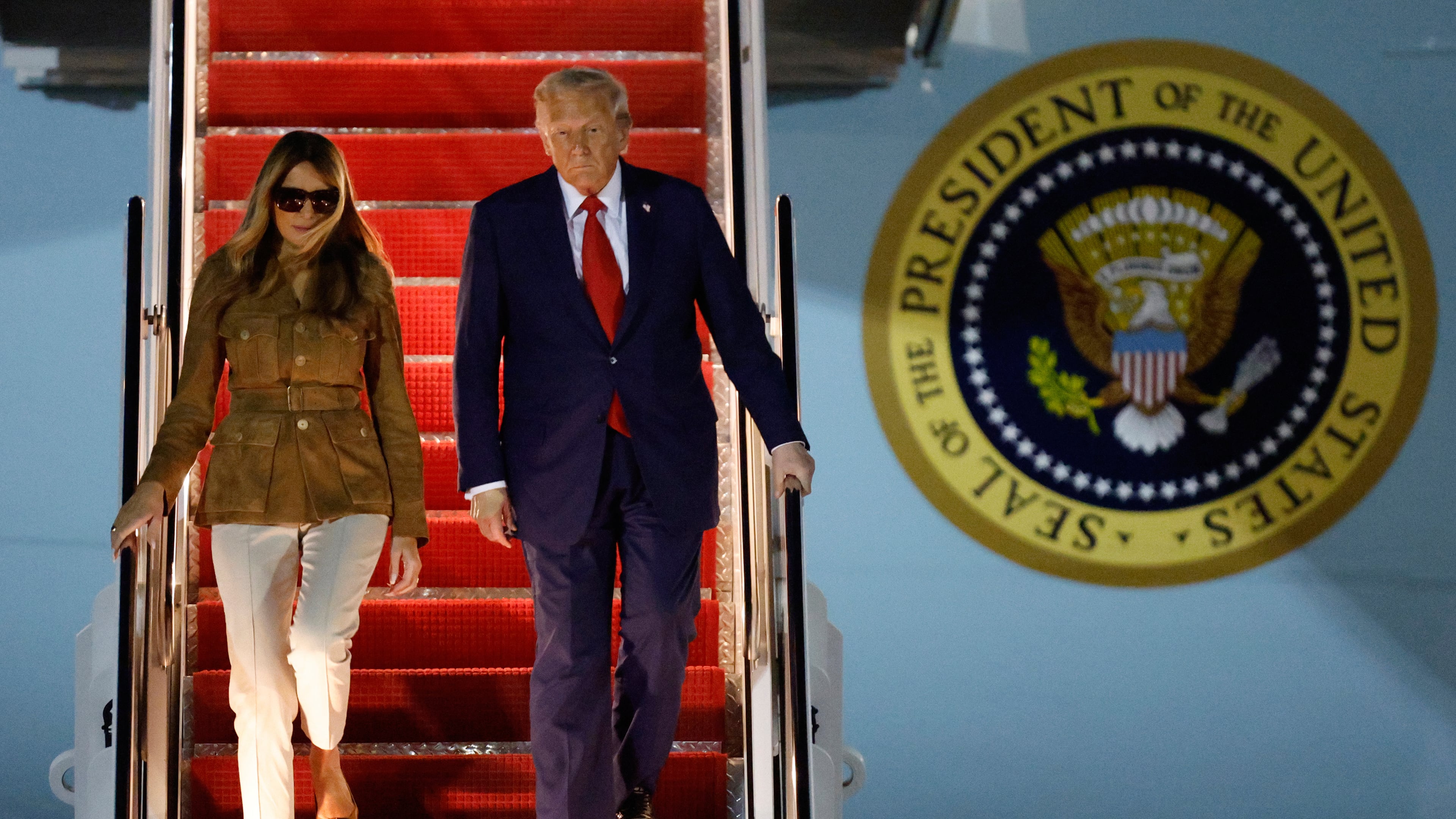 President Donald Trump and first lady Melania Trump disembark Air Force One at Joint Base Andrews, Md., Thursday, Sept. 18, 2025, after returning from a state visit to Britain. (AP Photo/Luis M. Alvarez)