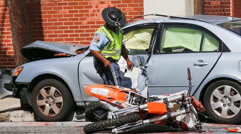 Law enforcement officials were investigating a fatal accident Fri., March 18, 2016, in Atlanta. JOHN SPINK / JSPINK@AJC.COM