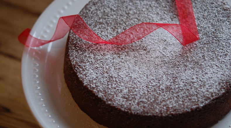 Flourless chocolate cake, like the torta Caprese (above), has Italian roots that can be traced back more than 100 years. (Meridith Ford for The Atlanta Journal-Constitution)