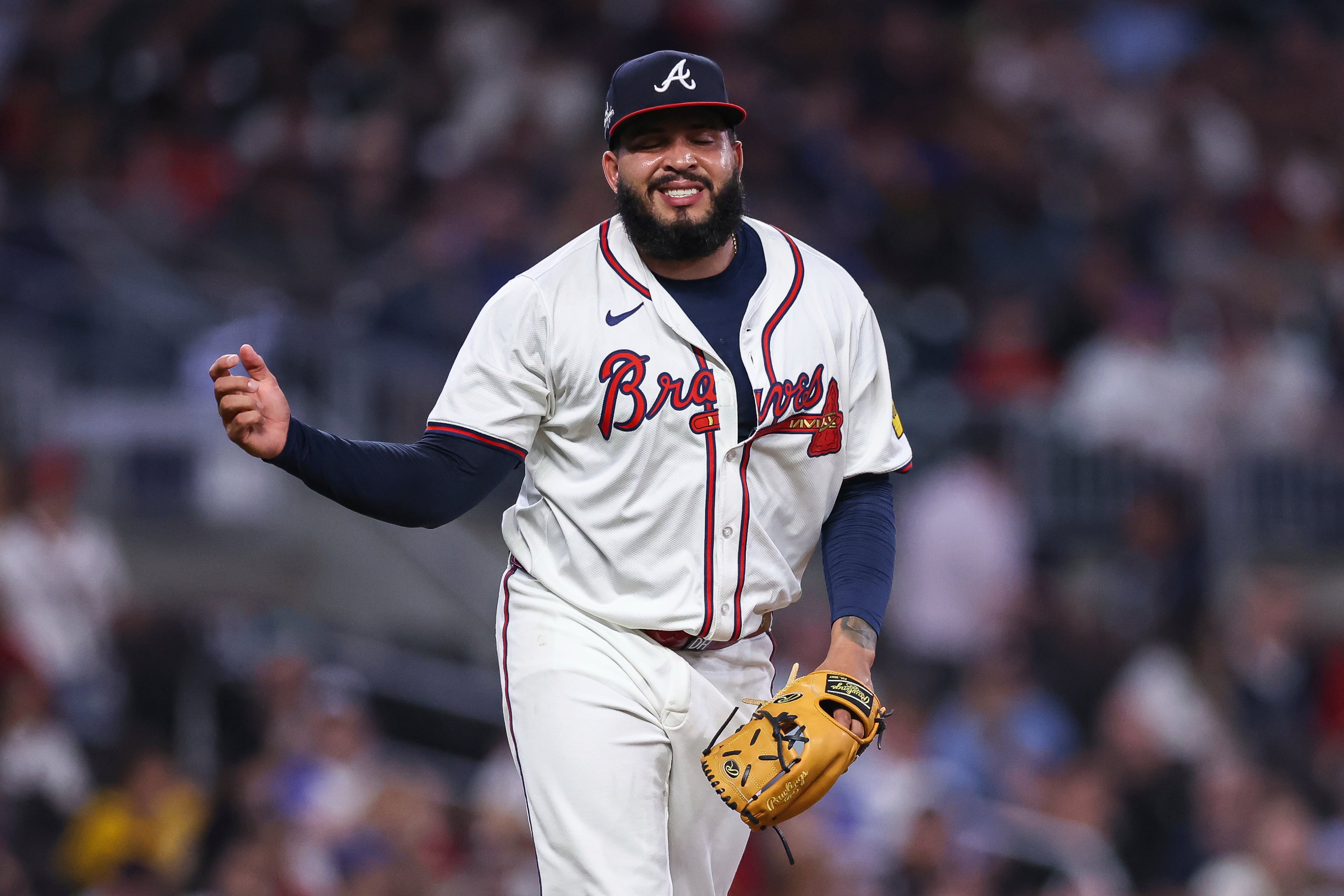 Atlanta Braves pitcher Daysbel Hernández grimaces after suffering an injury in the eighth inning of a baseball game against the Arizona Diamondbacks, Wednesday, June 4, 2025, in Atlanta. (AP Photo/Colin Hubbard)