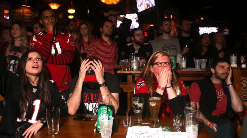 Atlanta, Georgia - Fans put their heads down as the Atlanta Falcons try to keep the New England Patriots at bay play in Super Bowl LI in Atlanta, Georgia, on Sunday. Henry Taylor, henry.taylor@ajc.com