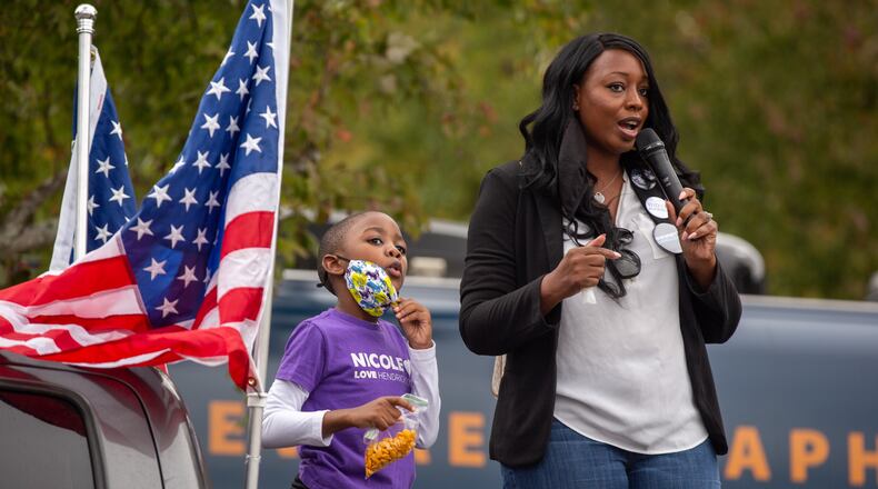 Gwinnett County Commission Chair candidate Nicole Love Hendrickson speaks at the Get Out The Early Vote at Shorty Howell Park in Duluth. Hendrickson appeared on Wednesday to have won her race. (Rebecca Wright for the Atlanta Journal-Constitution)