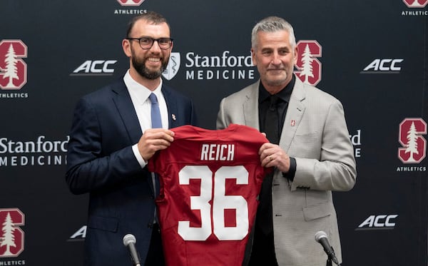 FILE - General Manager Andrew Luck, left, introduces Frank Reich as the new head coach of Stanford's college football team in Stanford, Calif., Tuesday, April 1, 2025. (AP Photo/Emily Steinberger, File)