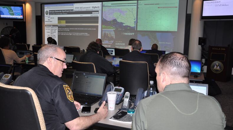DeKalb emergency management personnel watch weather developments (DEKALB COUNTY).