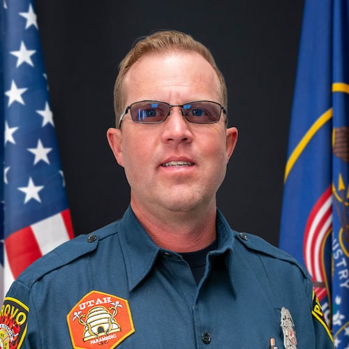 This photo provided by Provo Fire & Rescue, Monday, July 20, 2026, shows Provo Fire Department Capt. Spencer Long posing for an official portrait at the Provo City Hall in Provo, Utah, April 10, 2024. (Brett Borget/Provo Fire & Rescue via AP)