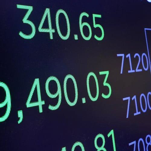FILE - A board above the trading floor of the New York Stock Exchange displays the closing number for the Dow Jones industrial average, April 22, 2026. (AP Photo/Richard Drew, File)
