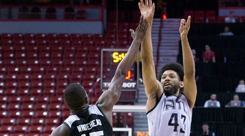 Atlanta Hawks forward DeAndre Bembry (43) shoots over Brooklyn Nets guard Isaiah Whitehead (15) during the NBA Summer League Monday, July 11, 2016, in Las Vegas.