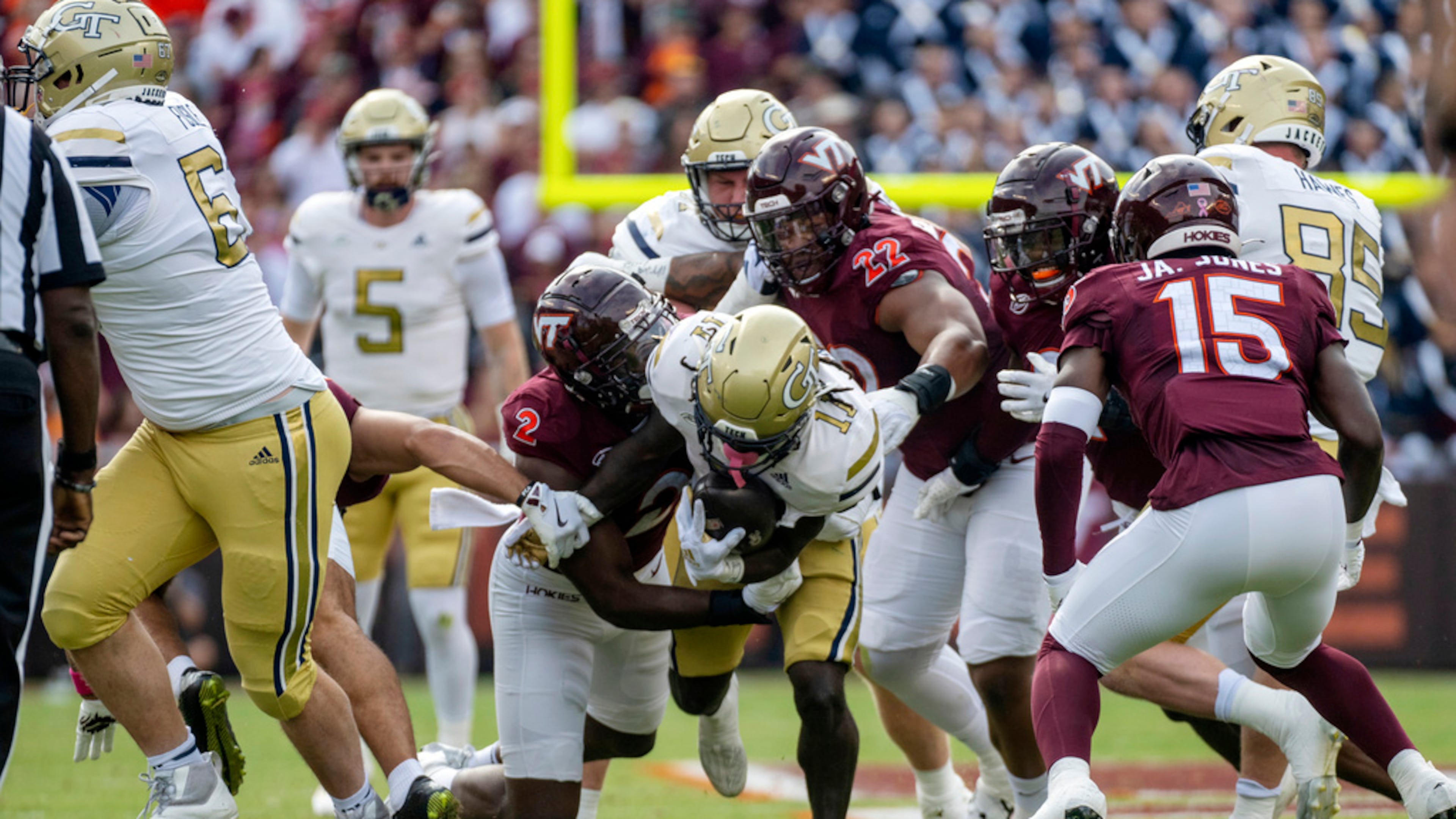 Georgia Tech's Jamal Haynes runs the ball against Virginia Tech defenders Keyshawn Burgos and Jaylen Jones during the first half of an NCAA college football game, in Blacksburg, Va. (Robert Simmons/AP 2024)