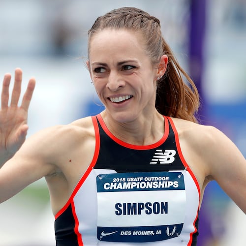 FILE - Jenny Simpson waves to a fan after winning her heat in the women's 1,500-meter run at the U.S. Championships athletics meet, Thursday, June 21, 2018, in Des Moines, Iowa. (AP Photo/Charlie Neibergall, File)
