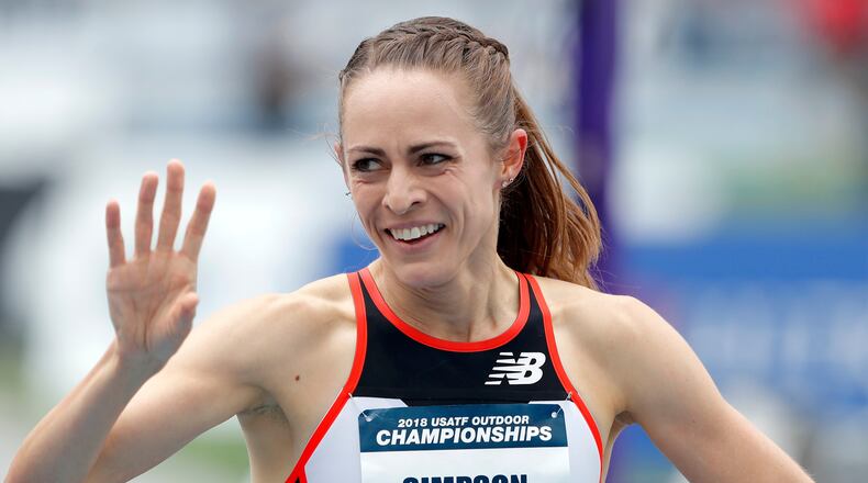 FILE - Jenny Simpson waves to a fan after winning her heat in the women's 1,500-meter run at the U.S. Championships athletics meet, Thursday, June 21, 2018, in Des Moines, Iowa. (AP Photo/Charlie Neibergall, File)