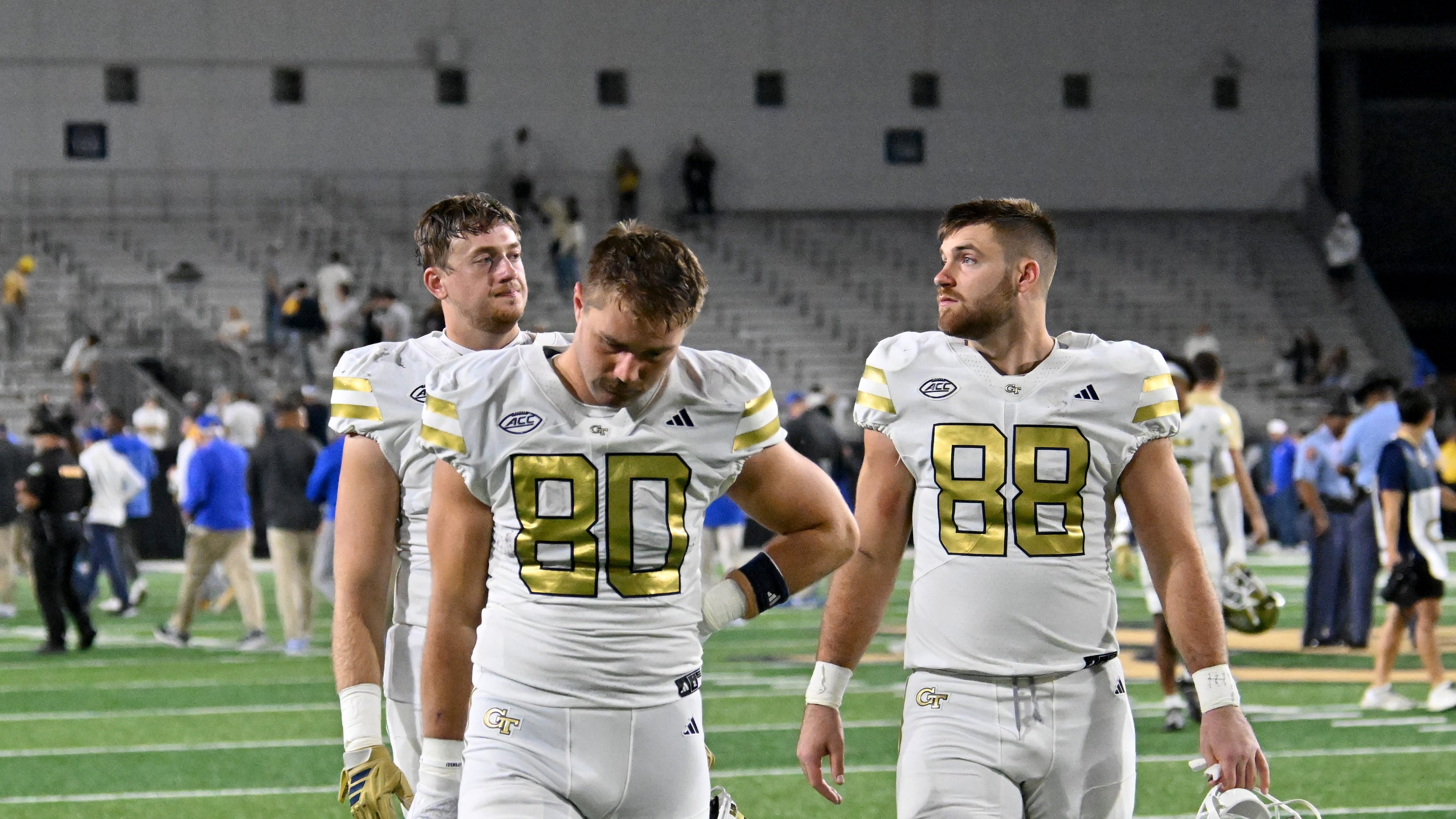 Georgia Tech players leave the field after Pittsburgh beat Georgia Tech during an NCAA college football game at Bobby Dodd Stadium, Saturday, November 22, 2025 in Atlanta. Pittsburgh won 42-28 over Georgia Tech. (Hyosub Shin / AJC)