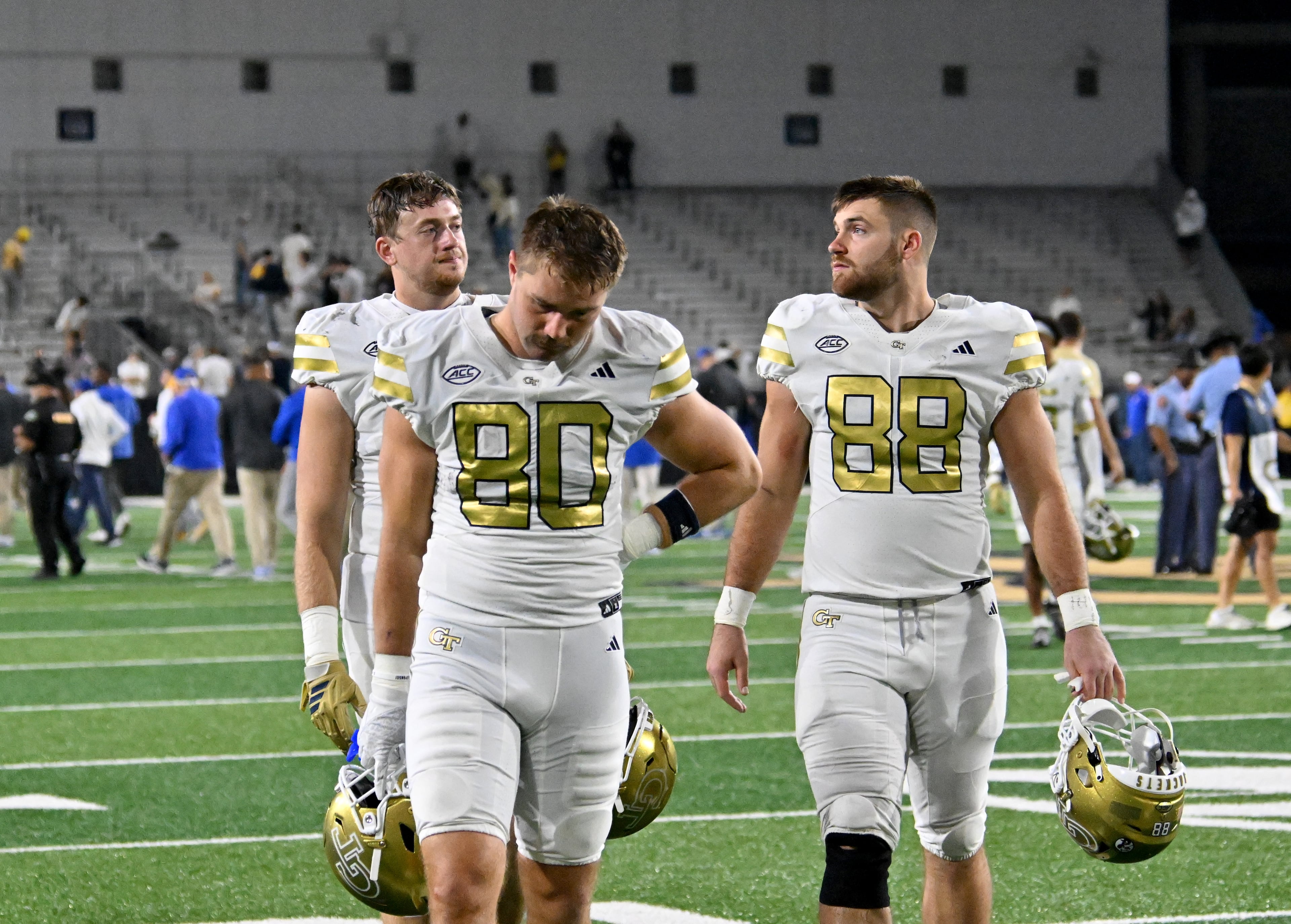 Georgia Tech players leave the field after Pittsburgh beat Georgia Tech during an NCAA college football game at Bobby Dodd Stadium, Saturday, November 22, 2025 in Atlanta. Pittsburgh won 42-28 over Georgia Tech. (Hyosub Shin / AJC)