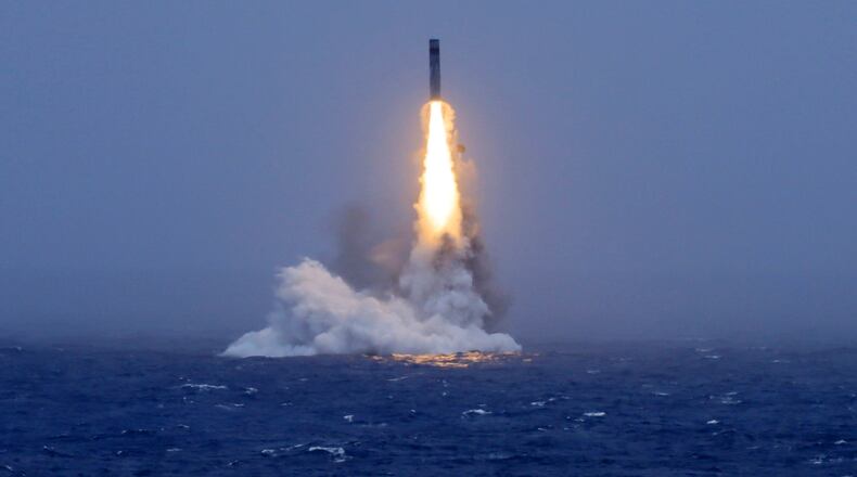 In this photo released by Xinhua News Agency, a long-range ballistic missile bursts out of the sea during a test launched from a Chinese nuclear-powered submarines in the South Pacific on Monday, July 6, 2026. (Li Xiangchao/Xinhua via AP)