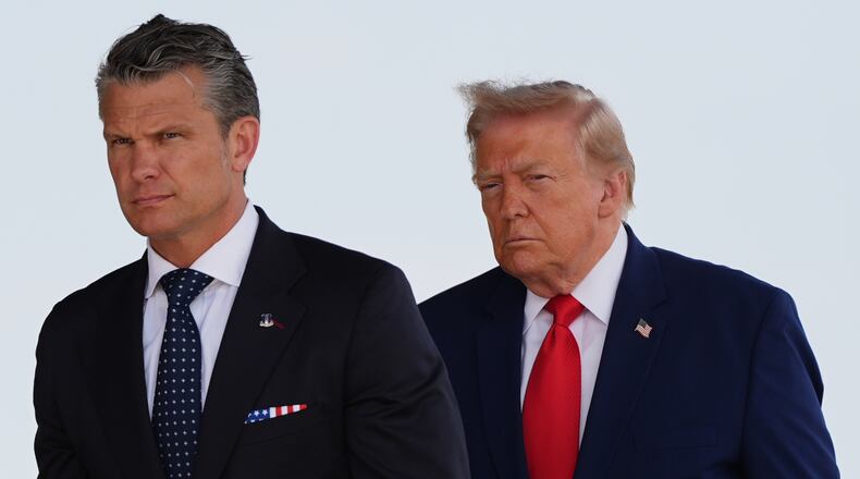 Defense Secretary Pete Hegseth and President Donald Trump attend the dignified transfer of four U.S. service members recently killed in the Middle East, Wednesday, July 22, 2026, at Dover Air Force Base, Del. (AP Photo/Julia Demaree Nikhinson)
