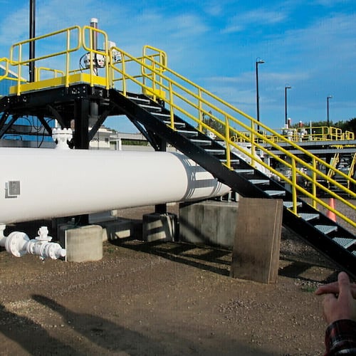FILE - An above-ground section of Enbridge's Line 5 is seen at the Mackinaw City, Mich., pump station, Oct. 7, 2016. (AP Photo/John Flesher, File)