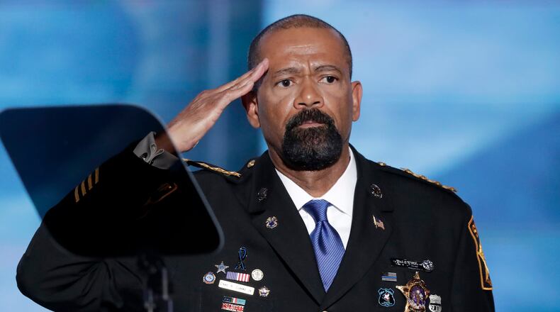 David Clarke, Sheriff of Milwaukee County, Wis., salutes after speaking during the opening day of the Republican National Convention in Cleveland, Monday, July 18, 2016. (AP Photo/J. Scott Applewhite)