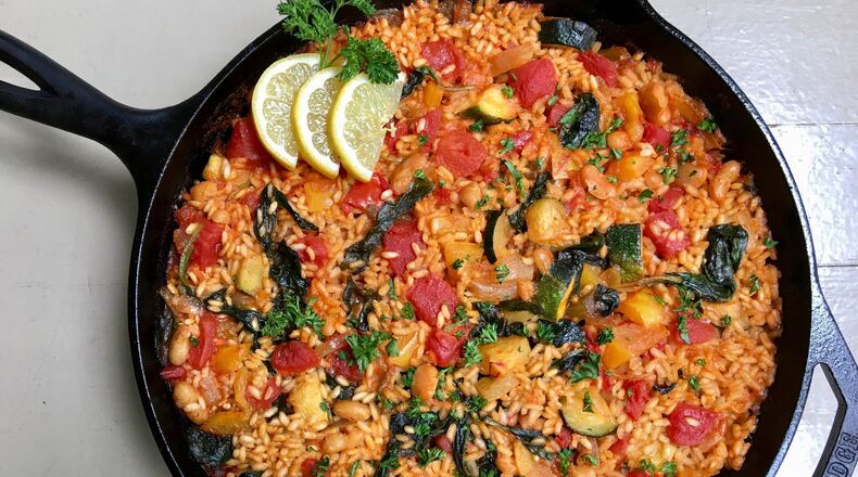 Fresh veggies and a cast-iron skillet transform white rice into weeknight paella. CONTRIBUTED BY KELLIE HYNES