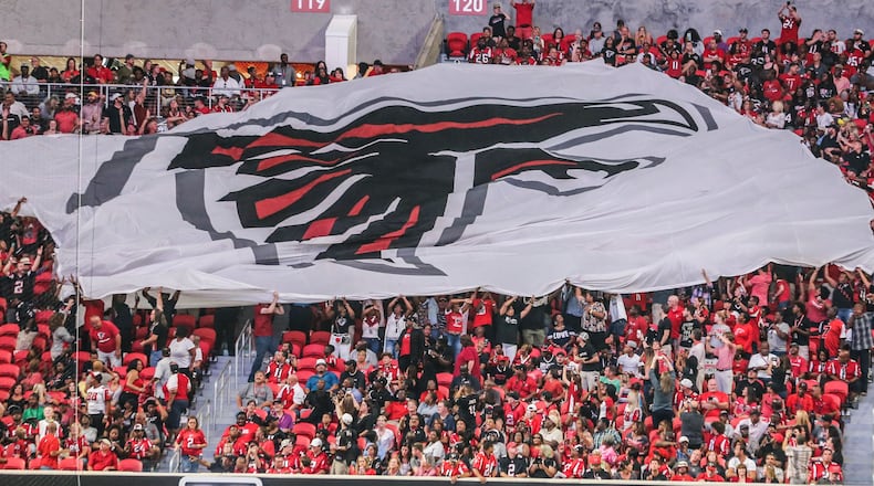 Passing the flag on Saturday, Aug. 26, 2017 at the opening of the brand new Mercedes Benz Stadium and pre-season NFL game between the Atlanta Falcons and the Arizona Cardinals. JOHN SPINK/JSPINK@AJC.COM