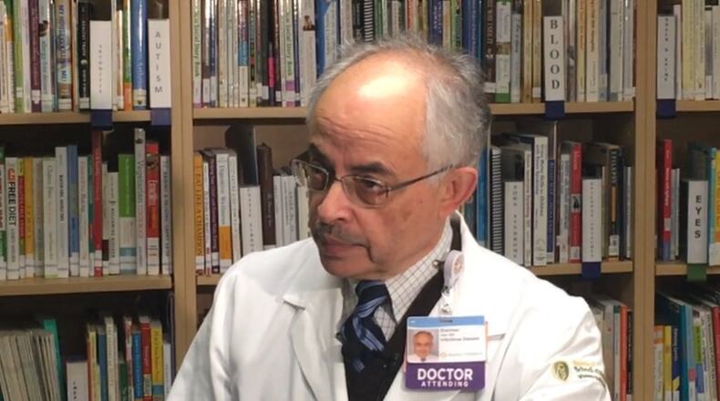 Dr. Sherman Alter, director of the infectious diseases department at Dayton Children’s Hospital, talks about increasing influenza cases that have led to school closings, on Feb. 10, 2017. JEREMY P. KELLEY / STAFF