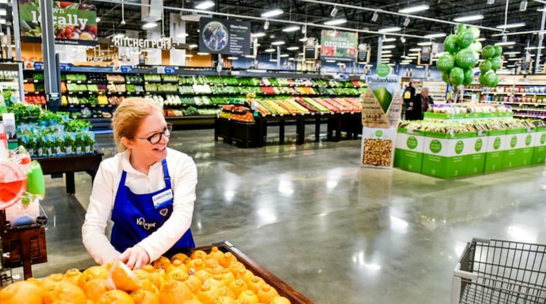 In this image dated June 2020, a Kroger employee restocks produce. Locally, a Kroger store in southwest Atlanta was forced to close after thieves stole critical electrical wiring, leaving the store without power. The store closure also left some individuals in surrounding neighborhoods with limited shopping options for fresh, healthy foods. (Nick Graham/daytondailynews.com).