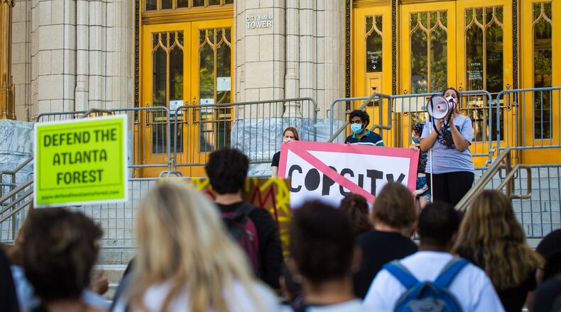 Demonstrators in support of defunding the police and a socialist democracy gather on the steps of Atlanta City Hall on Sunday, Aug 15, 2021 in opposition to a $90 million proposed police training facility that will be built on 381 acres of green space known as Old Atlanta Prison Farm. (Jenni Girtman for The Atlanta Journal Constitution)