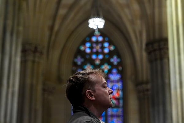 A parishioner prays during a memorial mass for the late Pope Francis at St. Patrick's Cathedral, Saturday, April 26, 2025, in New York. (AP Photo/Julia Demaree Nikhinson)